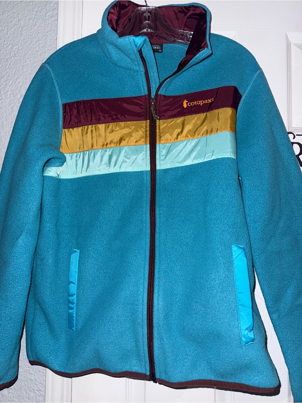 Cotopaxi woman’s Teal Zip-Up Fleece Jacket with Colorblock Stripes